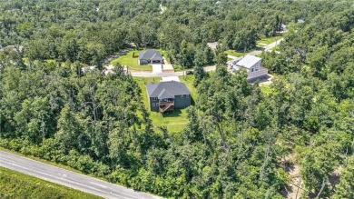 Tucked into the wooded hills of Bella Vista, this home delivers on Bella Vista Country Club - Highlands in Arkansas - for sale on GolfHomes.com, golf home, golf lot