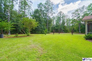 This beautiful home is on a corner lot in Club Colony. If you on Hartsville Country Club in South Carolina - for sale on GolfHomes.com, golf home, golf lot