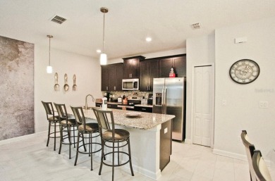 Fully furnished and decorated 4BR/3BA pool home in the on The Oasis Club at Champions Gate in Florida - for sale on GolfHomes.com, golf home, golf lot