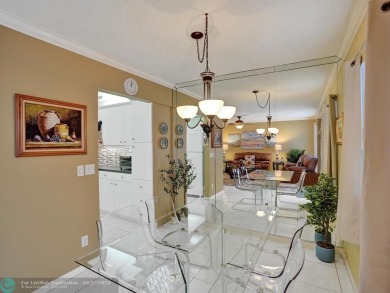 Price adjustment on this beautiful 3rd floor lakefront unit on Hillsboro Pines Golf in Florida - for sale on GolfHomes.com, golf home, golf lot