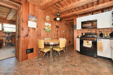This charming cottage with approx 250 feet of direct water front on Bend Of The River Golf Course in New York - for sale on GolfHomes.com, golf home, golf lot