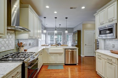 Beautiful home in Wakefield backing up to the executive golf on TPC at Wakefield Plantation in North Carolina - for sale on GolfHomes.com, golf home, golf lot