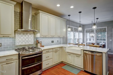 Beautiful home in Wakefield backing up to the executive golf on TPC at Wakefield Plantation in North Carolina - for sale on GolfHomes.com, golf home, golf lot