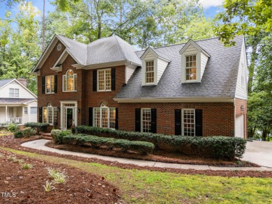 Nestled on a desirable corner lot, surrounded by mature trees in on Devils Ridge Golf Club in North Carolina - for sale on GolfHomes.com, golf home, golf lot