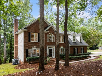 Nestled on a desirable corner lot, surrounded by mature trees in on Devils Ridge Golf Club in North Carolina - for sale on GolfHomes.com, golf home, golf lot