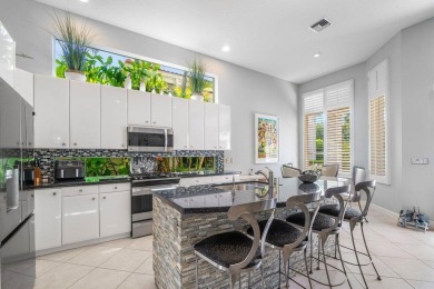 Paradise and a FULL GOLF MEMBERSHIP await you at 138 Isle Drive! on BallenIsles Golf and Country Club in Florida - for sale on GolfHomes.com, golf home, golf lot