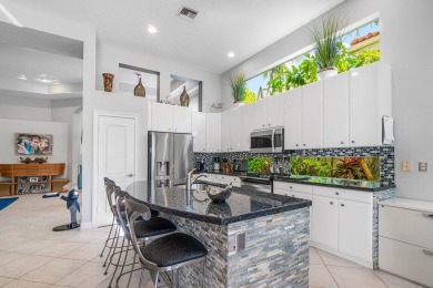 Paradise and a FULL GOLF MEMBERSHIP await you at 138 Isle Drive! on BallenIsles Golf and Country Club in Florida - for sale on GolfHomes.com, golf home, golf lot