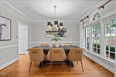 Nestled on a desirable corner lot, surrounded by mature trees in on Devils Ridge Golf Club in North Carolina - for sale on GolfHomes.com, golf home, golf lot