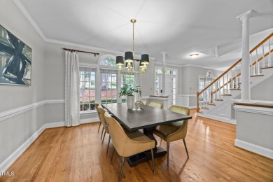 Nestled on a desirable corner lot, surrounded by mature trees in on Devils Ridge Golf Club in North Carolina - for sale on GolfHomes.com, golf home, golf lot