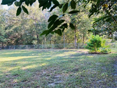 Charming three-bedroom, two-bathroom home featuring a two-car on Citrus Springs Country Club in Florida - for sale on GolfHomes.com, golf home, golf lot