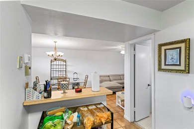 Beautifully maintained top-floor unit in sought-after Hollybrook on Hollybrook Golf and Tennis Club  in Florida - for sale on GolfHomes.com, golf home, golf lot