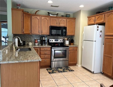 Charming three-bedroom, two-bathroom home featuring a two-car on Citrus Springs Country Club in Florida - for sale on GolfHomes.com, golf home, golf lot