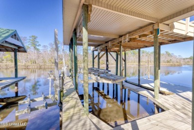 5 Bedrooms | 6 Baths | Over 7,500 Sq Ft | Bayou Front | Fully on Diamondhead Country Club in Mississippi - for sale on GolfHomes.com, golf home, golf lot