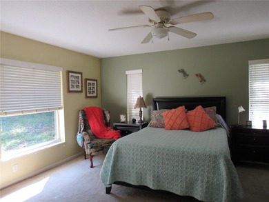 Charming three-bedroom, two-bathroom home featuring a two-car on Citrus Springs Country Club in Florida - for sale on GolfHomes.com, golf home, golf lot