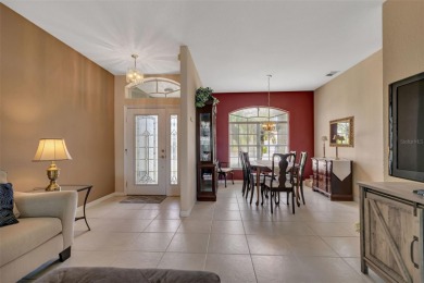SENSATIONAL WATER VIEW from a MASSIVE enclosed and tiled lanai on Kings Gate Golf Club in Florida - for sale on GolfHomes.com, golf home, golf lot