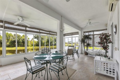 SENSATIONAL WATER VIEW from a MASSIVE enclosed and tiled lanai on Kings Gate Golf Club in Florida - for sale on GolfHomes.com, golf home, golf lot