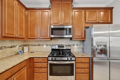 MAINTENANCE-FREE ELEGANCE WITH POND VIEWS! Welcome to your on Esplanade Golf and Country at Lakewood Ranch in Florida - for sale on GolfHomes.com, golf home, golf lot