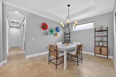 MAINTENANCE-FREE ELEGANCE WITH POND VIEWS! Welcome to your on Esplanade Golf and Country at Lakewood Ranch in Florida - for sale on GolfHomes.com, golf home, golf lot