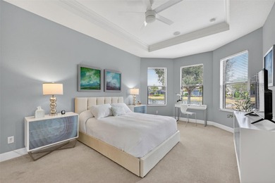 MAINTENANCE-FREE ELEGANCE WITH POND VIEWS! Welcome to your on Esplanade Golf and Country at Lakewood Ranch in Florida - for sale on GolfHomes.com, golf home, golf lot