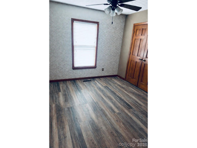 Luxury golf-course living awaits at this custom renovated on Brushy Mountain Golf Course in North Carolina - for sale on GolfHomes.com, golf home, golf lot