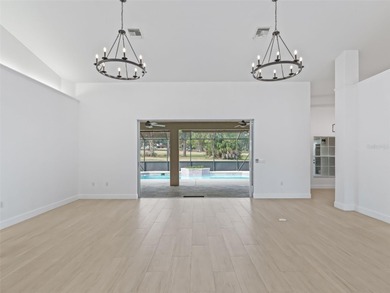 This exquisitely updated 3 bedroom 2 bath pool home is located on Golden Hills Golf and Turf Club in Florida - for sale on GolfHomes.com, golf home, golf lot