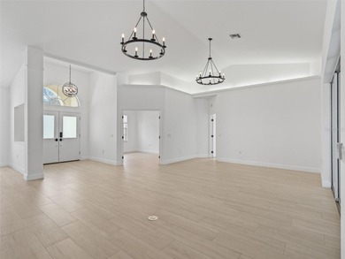 This exquisitely updated 3 bedroom 2 bath pool home is located on Golden Hills Golf and Turf Club in Florida - for sale on GolfHomes.com, golf home, golf lot