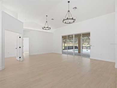 This exquisitely updated 3 bedroom 2 bath pool home is located on Golden Hills Golf and Turf Club in Florida - for sale on GolfHomes.com, golf home, golf lot