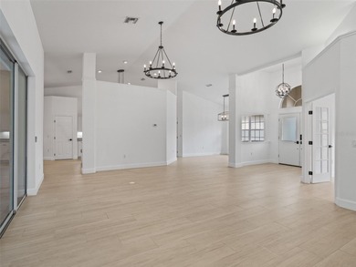 This exquisitely updated 3 bedroom 2 bath pool home is located on Golden Hills Golf and Turf Club in Florida - for sale on GolfHomes.com, golf home, golf lot