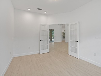 This exquisitely updated 3 bedroom 2 bath pool home is located on Golden Hills Golf and Turf Club in Florida - for sale on GolfHomes.com, golf home, golf lot