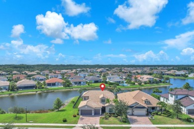 This stunning waterfront home, situated on a rare, ultra-premium on Jupiter Country Club in Florida - for sale on GolfHomes.com, golf home, golf lot