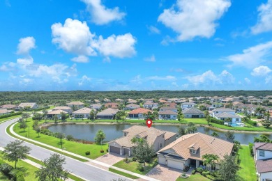 This stunning waterfront home, situated on a rare, ultra-premium on Jupiter Country Club in Florida - for sale on GolfHomes.com, golf home, golf lot