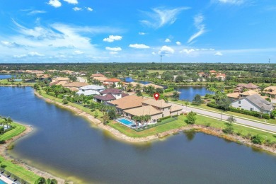 This stunning waterfront home, situated on a rare, ultra-premium on Jupiter Country Club in Florida - for sale on GolfHomes.com, golf home, golf lot