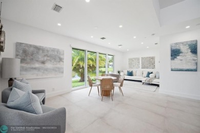 Stunning Luxury waterfront pool home in exclusive Weston Hills on Weston Hills Country Club in Florida - for sale on GolfHomes.com, golf home, golf lot