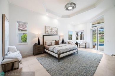 Stunning Luxury waterfront pool home in exclusive Weston Hills on Weston Hills Country Club in Florida - for sale on GolfHomes.com, golf home, golf lot