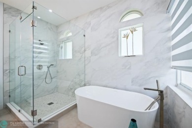 Stunning Luxury waterfront pool home in exclusive Weston Hills on Weston Hills Country Club in Florida - for sale on GolfHomes.com, golf home, golf lot