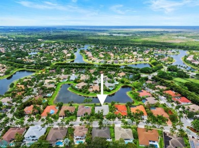 Stunning Luxury waterfront pool home in exclusive Weston Hills on Weston Hills Country Club in Florida - for sale on GolfHomes.com, golf home, golf lot