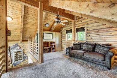 This log home comes fully furnished and is a true mountain on Raven Golf Club At Three Peaks in Colorado - for sale on GolfHomes.com, golf home, golf lot