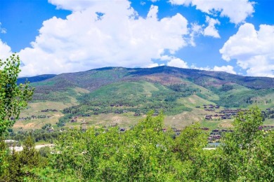 This log home comes fully furnished and is a true mountain on Raven Golf Club At Three Peaks in Colorado - for sale on GolfHomes.com, golf home, golf lot