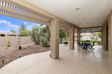 Nestled in a vibrant gated active adult community, this stunning on Palo Verde Golf and Country Club in Arizona - for sale on GolfHomes.com, golf home, golf lot