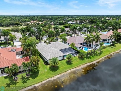 Stunning Luxury waterfront pool home in exclusive Weston Hills on Weston Hills Country Club in Florida - for sale on GolfHomes.com, golf home, golf lot