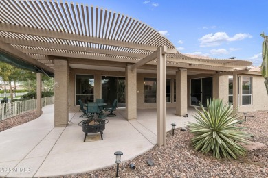 Nestled in a vibrant gated active adult community, this stunning on Palo Verde Golf and Country Club in Arizona - for sale on GolfHomes.com, golf home, golf lot