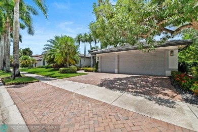 Stunning Luxury waterfront pool home in exclusive Weston Hills on Weston Hills Country Club in Florida - for sale on GolfHomes.com, golf home, golf lot