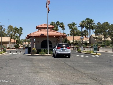 Nestled in a vibrant gated active adult community, this stunning on Palo Verde Golf and Country Club in Arizona - for sale on GolfHomes.com, golf home, golf lot