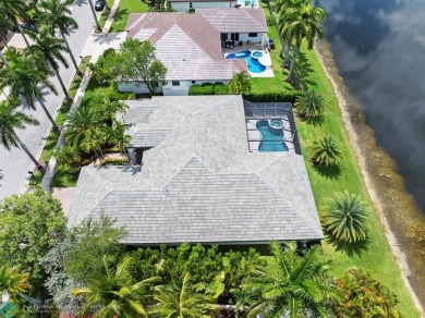 Stunning Luxury waterfront pool home in exclusive Weston Hills on Weston Hills Country Club in Florida - for sale on GolfHomes.com, golf home, golf lot