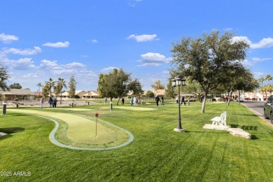 Nestled in a vibrant gated active adult community, this stunning on Palo Verde Golf and Country Club in Arizona - for sale on GolfHomes.com, golf home, golf lot