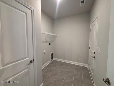 Home is complete. Nestled in a gated community, this on River Landing Golf Course in North Carolina - for sale on GolfHomes.com, golf home, golf lot