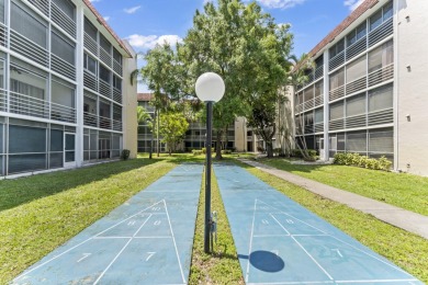 Beautiful & Bright 2-Bedroom, 2-Bath Condo with Serene Canal on Inverrary Country Club in Florida - for sale on GolfHomes.com, golf home, golf lot