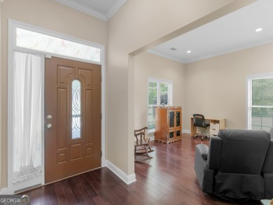 This gorgeous 3 bedroom/2.5 bathroom brick home is located on on Canongate At Georgia National Golf Club in Georgia - for sale on GolfHomes.com, golf home, golf lot