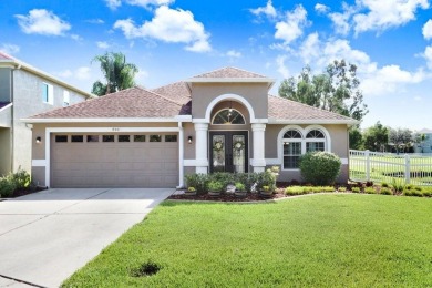 Experience Florida living at its finest in this stunning on Heritage Harbor Golf and Country Club in Florida - for sale on GolfHomes.com, golf home, golf lot