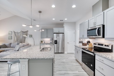 Thoughtfully designed and meticulously maintained, this Camellia on LPGA International Golf Course in Florida - for sale on GolfHomes.com, golf home, golf lot